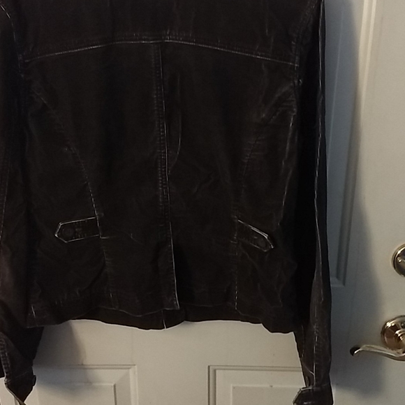 Black denim jacket with white running through it. - Picture 3 of 4
